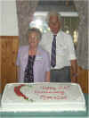 cakeand_couple.jpg (27662 bytes)